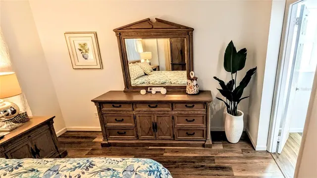 a view of living room with a flat tv screen and a dresser