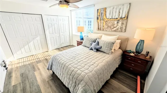 a bedroom with bed and window