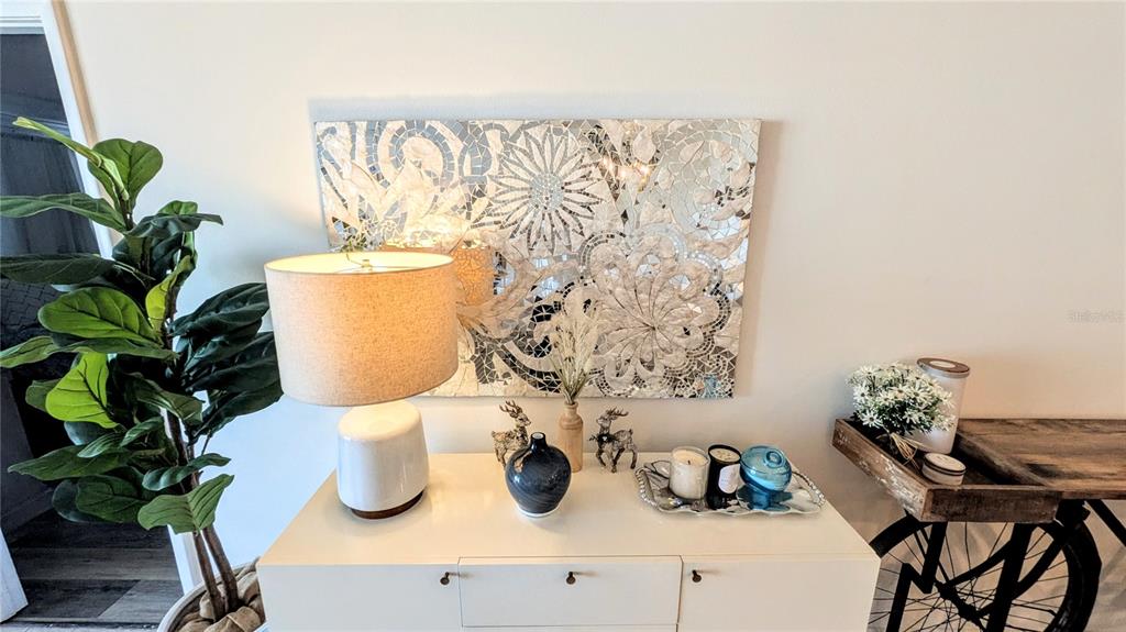 101 South Gulfstream Avenue, Unit 7E Sarasota, FL 34236 - Photo 26 of 40 a white vase with flowers on a table