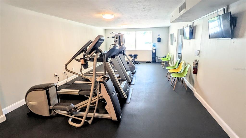 101 South Gulfstream Avenue, Unit 7E Sarasota, FL 34236 - Photo 33 of 40 a view of a room with gym equipment