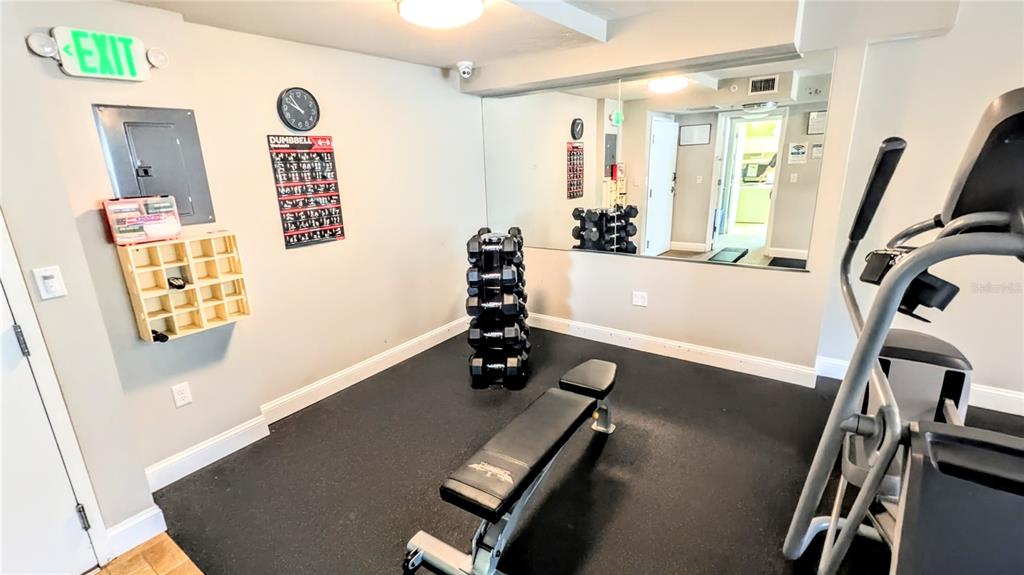 101 South Gulfstream Avenue, Unit 7E Sarasota, FL 34236 - Photo 34 of 40 a view of a room with gym equipment