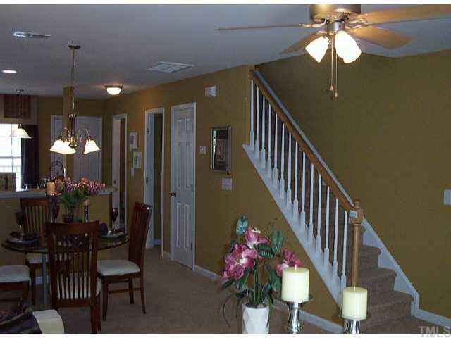 3713 Bison Hill Lane Raleigh, NC 27604 - Photo 1 of 1 a dining room with furniture and chandelier