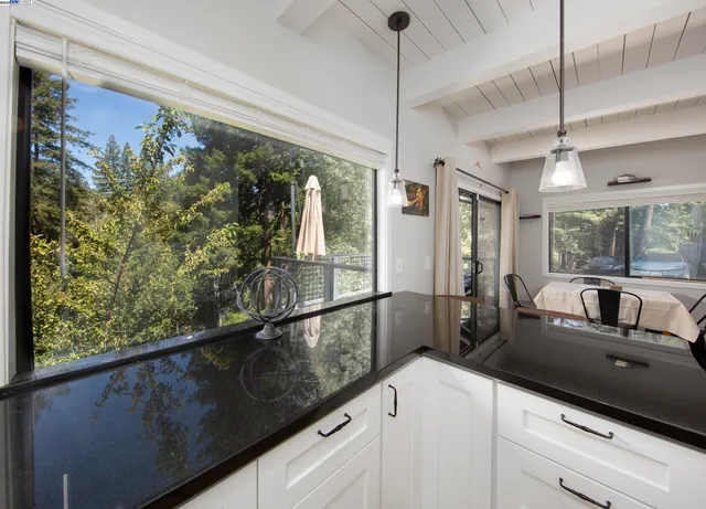 a kitchen with a large window and a sink