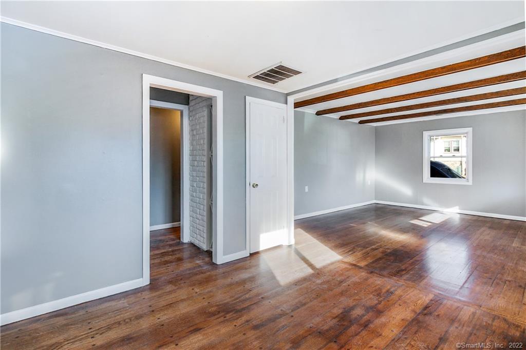 75 Van Buskirk Avenue, Unit 75 Stamford, CT 06902 - Photo 6 of 25 a view of livingroom with hardwood floor and hallway