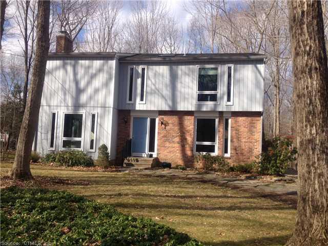 80 Spicer Hill Road Ledyard, CT 06339 - Photo 1 of 1 a front view of brick house with a yard