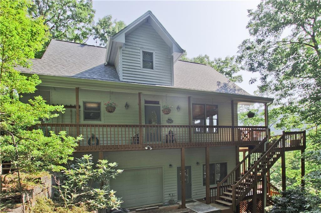 a front view of house along with green space