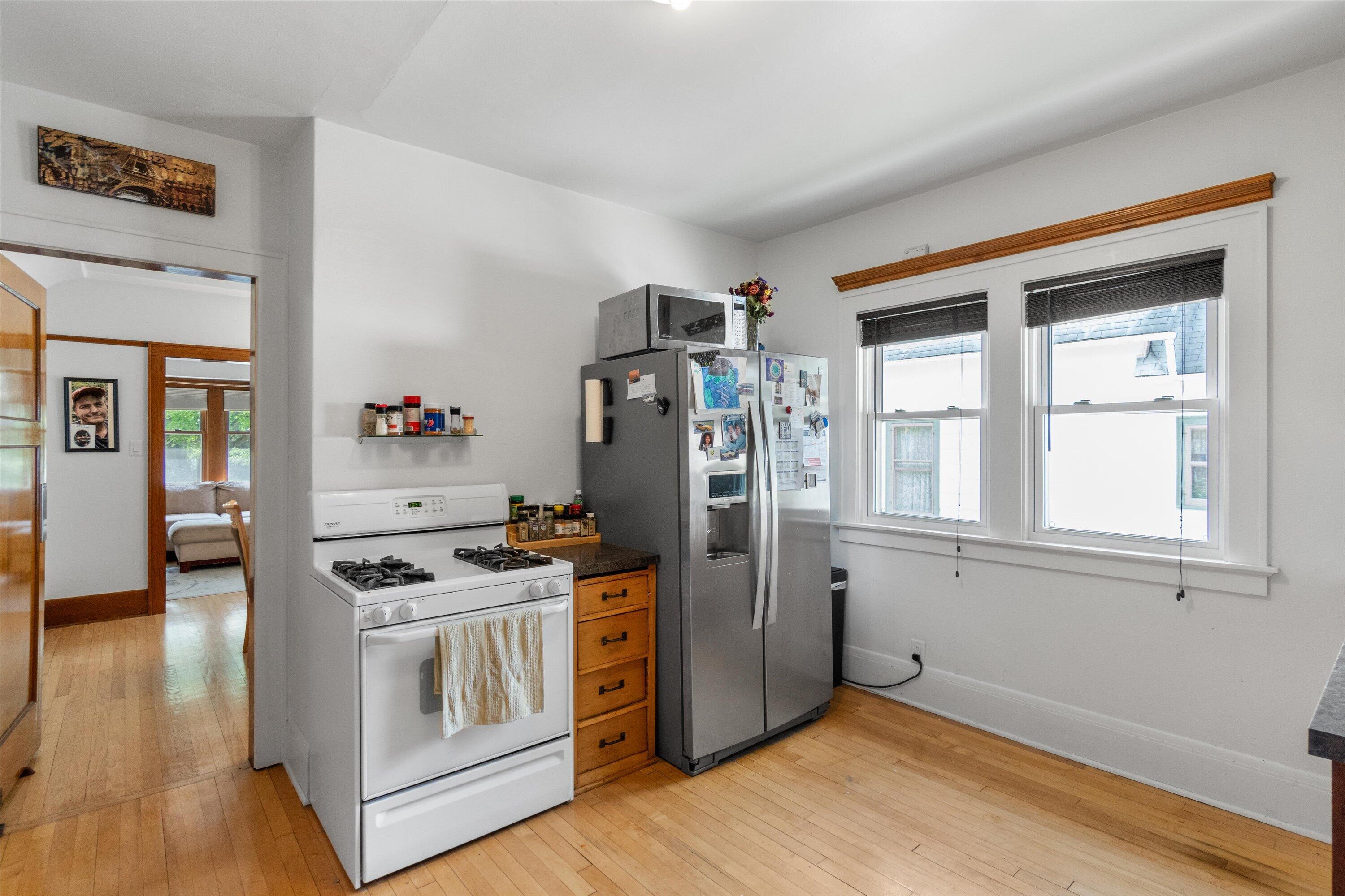 159 North 59th Street Milwaukee, WI 53213 - Photo 24 of 34 Functional kitchen layout with hardwood floors and direct access to additional storage