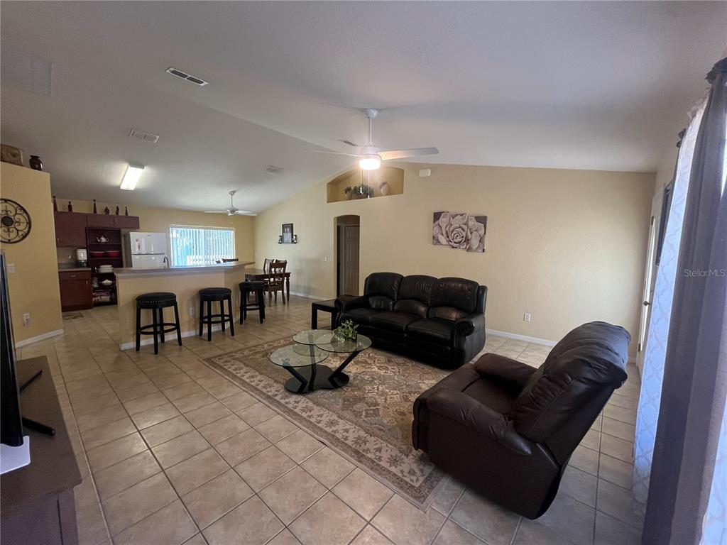 13615 Southeast 44th Terrace Summerfield, FL 34491 - Photo 5 of 26 a living room with furniture and a table