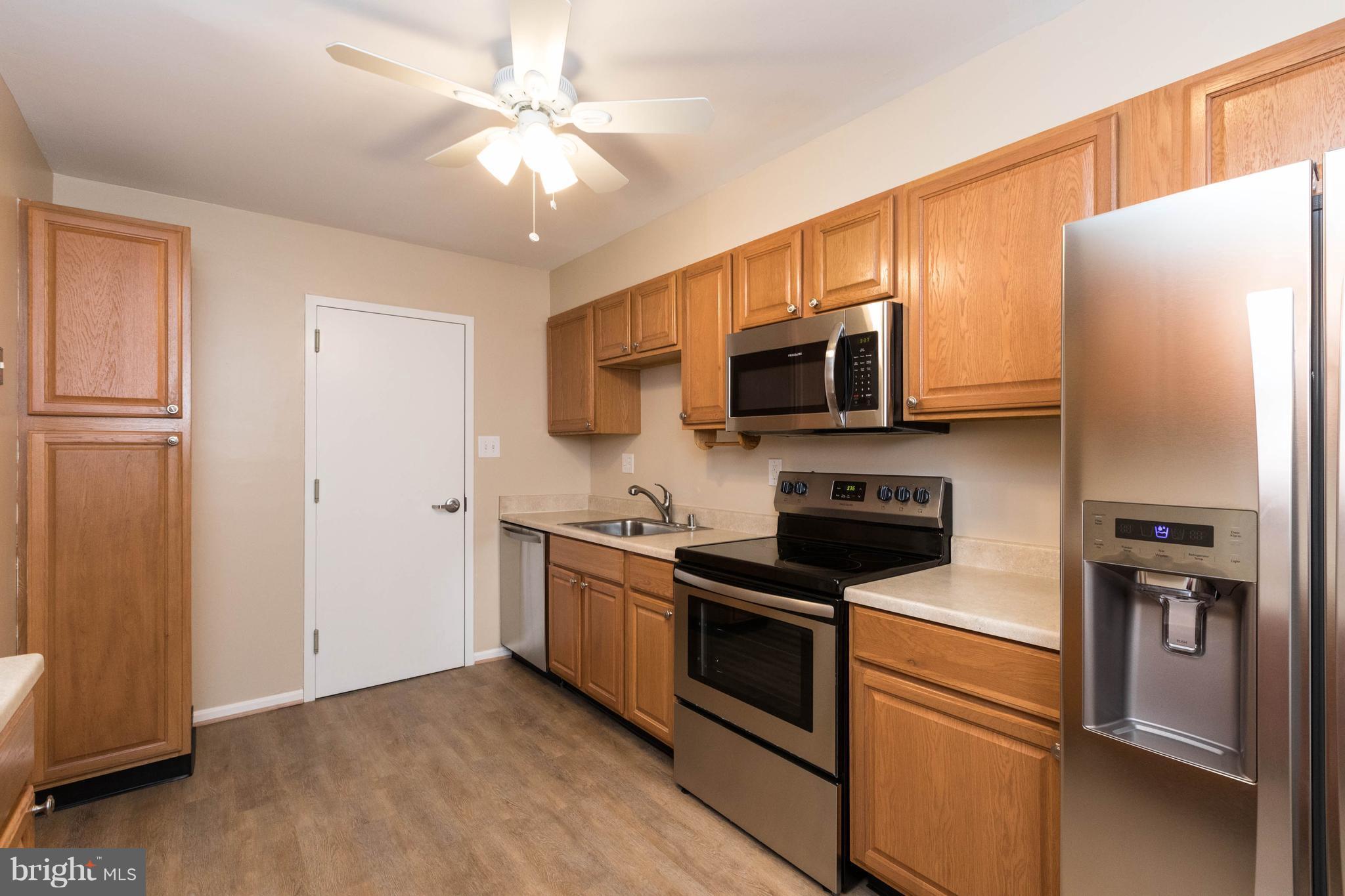 4555 Ryan Place Waldorf, MD 20602 - Photo 2 of 30 a kitchen with stainless steel appliances a stove microwave and a refrigerator