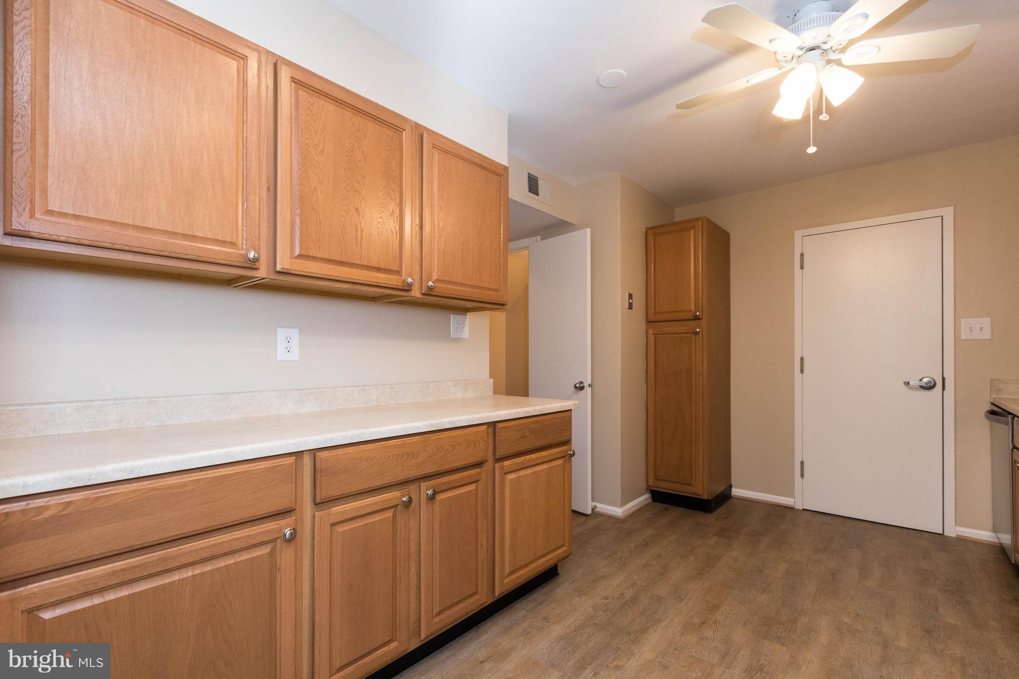4555 Ryan Place Waldorf, MD 20602 - Photo 19 of 30 a view of cabinets with wooden floor and cabinets