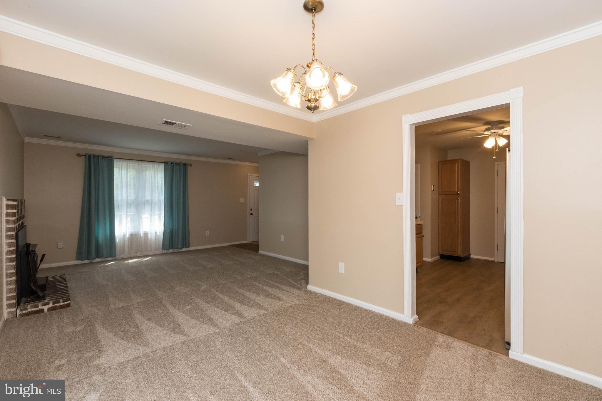 4555 Ryan Place Waldorf, MD 20602 - Photo 3 of 30 a view of a chandelier in a room with a chandelier