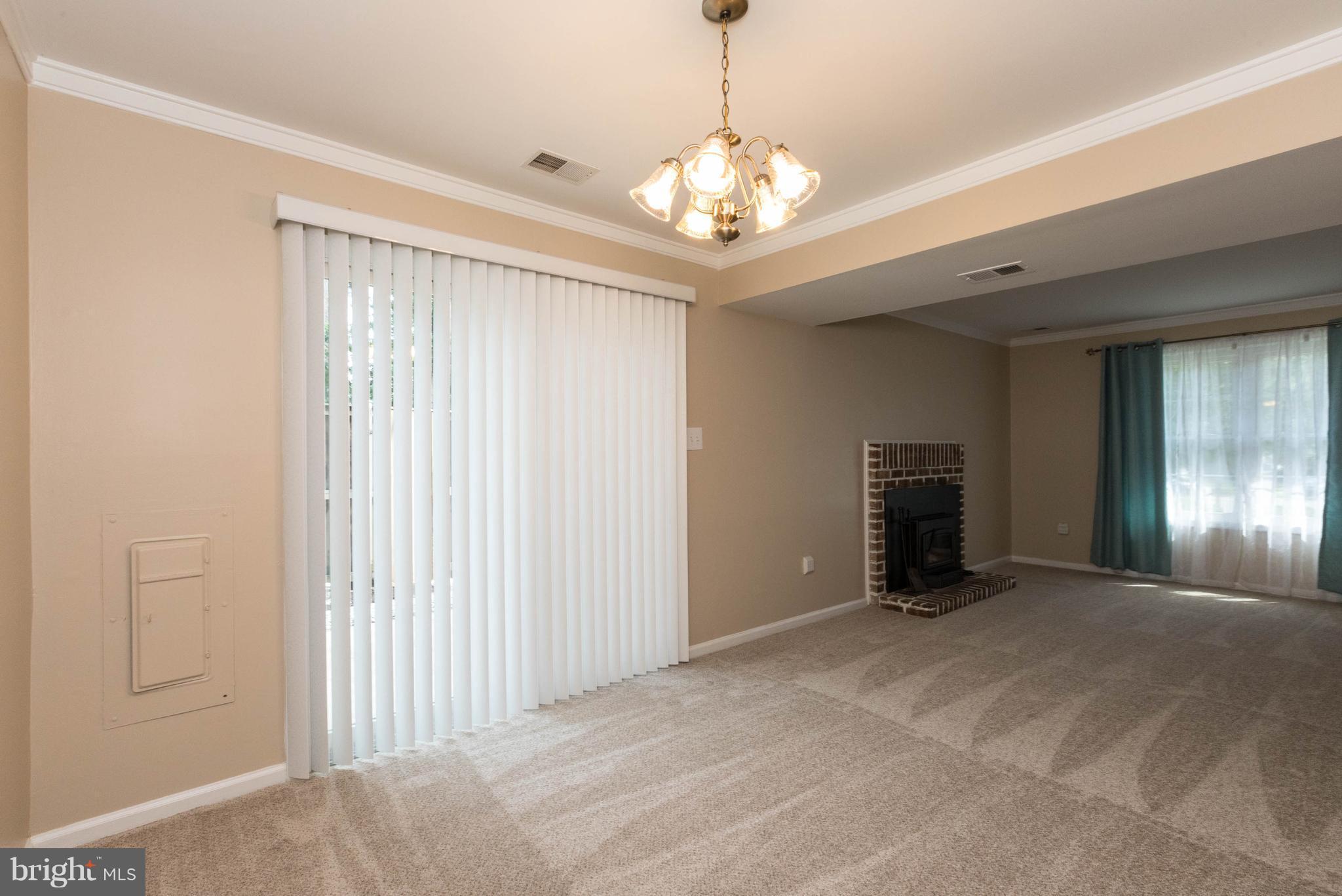 4555 Ryan Place Waldorf, MD 20602 - Photo 23 of 30 a view of an empty room with window and chandelier