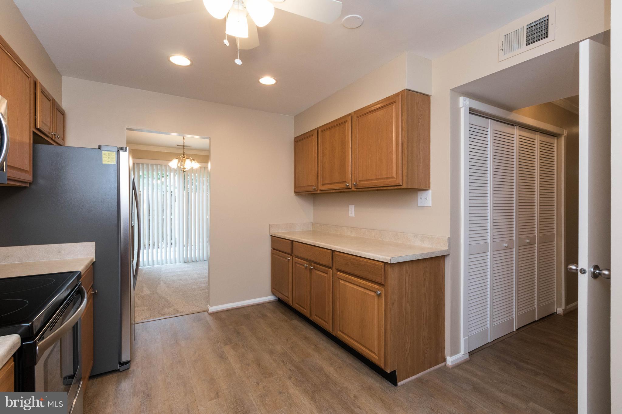 4555 Ryan Place Waldorf, MD 20602 - Photo 9 of 30 a kitchen with granite countertop a stove and a refrigerator