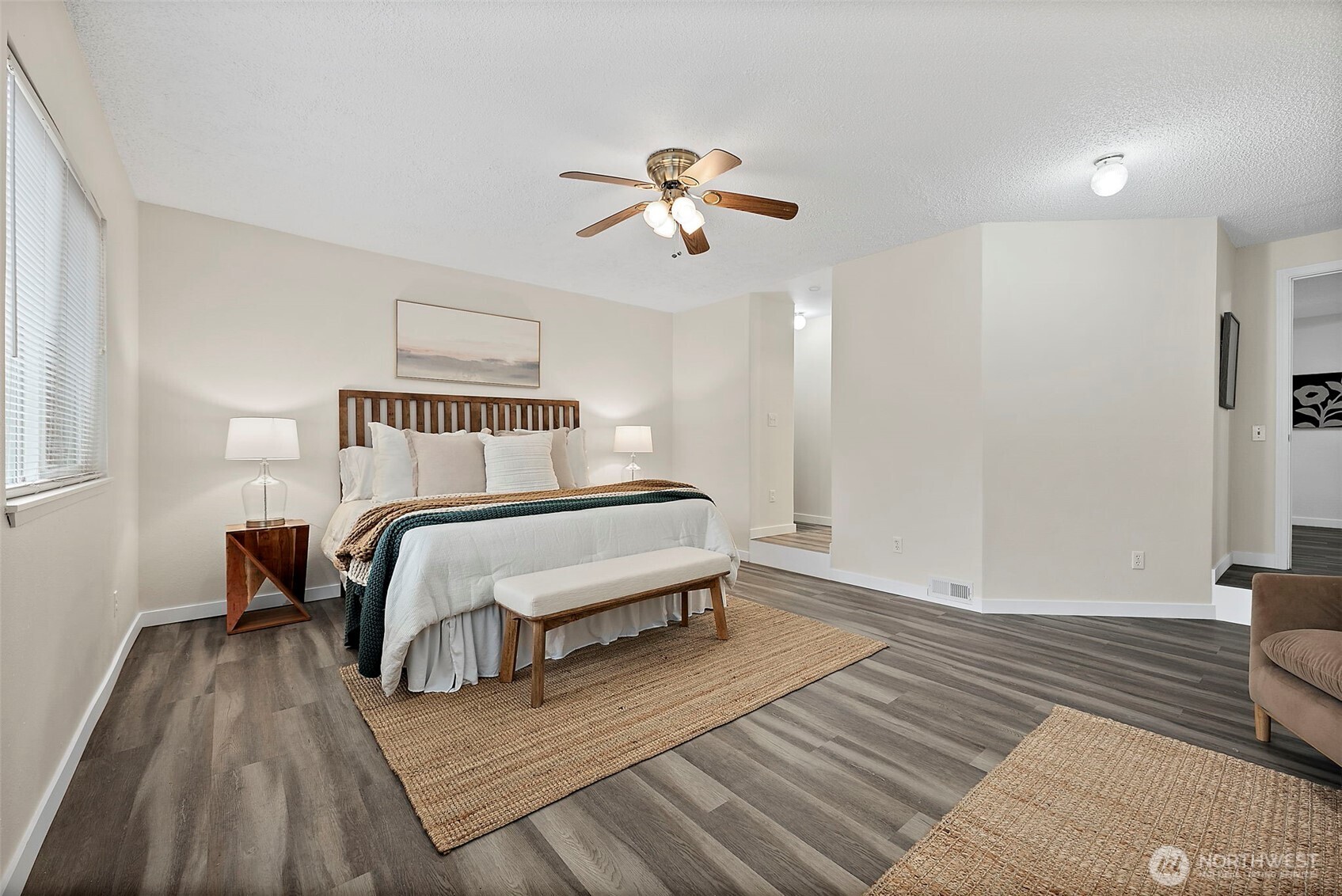 1117 17th Street Southwest Puyallup, WA 98371 - Photo 18 of 40 a bedroom with a bed and wooden floor