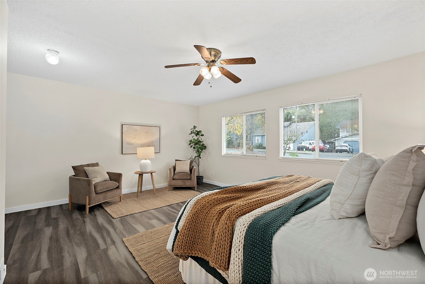 1117 17th Street Southwest Puyallup, WA 98371 - Photo 20 of 40 a bedroom with a bed and wooden floor