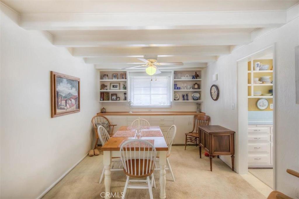 612 South Orange Street Orange, CA 92866 - Photo 15 of 44 a living room with furniture a dining table and paintings on the wall