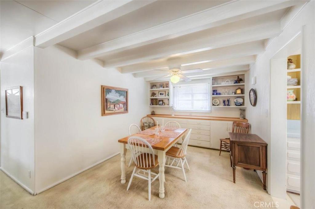 612 South Orange Street Orange, CA 92866 - Photo 16 of 44 a dining room with a wooden table and chairs