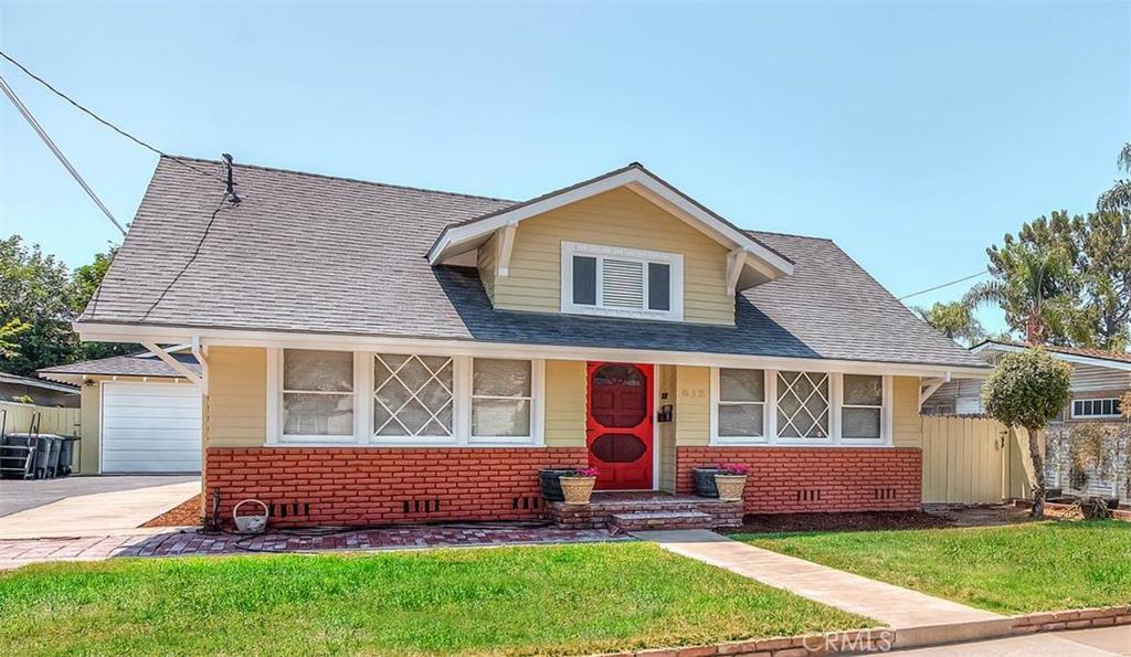 612 South Orange Street Orange, CA 92866 - Photo 2 of 44 a front view of a house with a yard