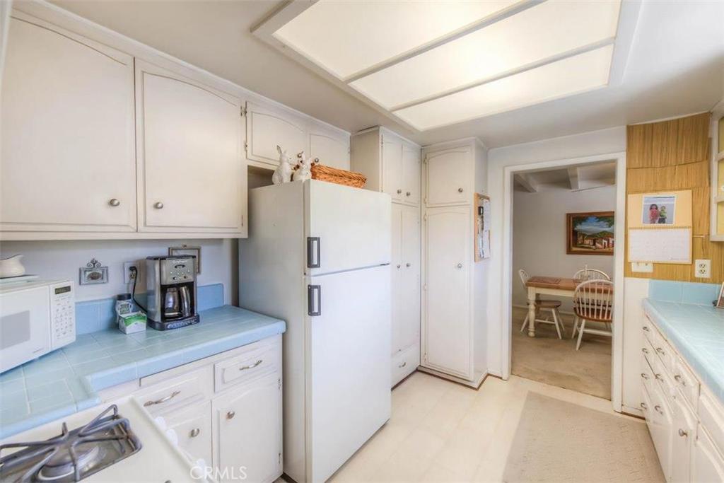 612 South Orange Street Orange, CA 92866 - Photo 23 of 44 a kitchen with stainless steel appliances a refrigerator and cabinets