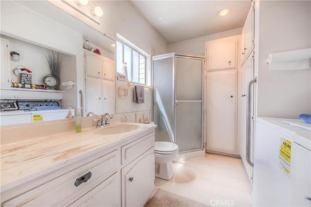 612 South Orange Street Orange, CA 92866 - Photo 24 of 44 a spacious bathroom with a granite countertop sink and a mirror