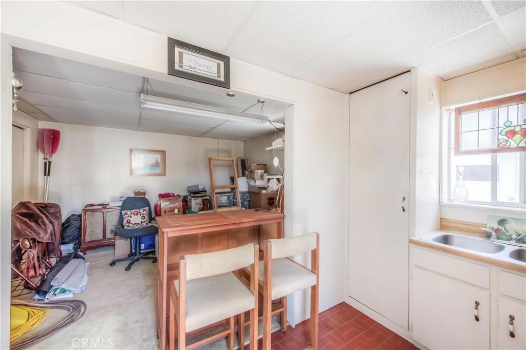 612 South Orange Street Orange, CA 92866 - Photo 37 of 44 a view of a workspace with furniture and a kitchen