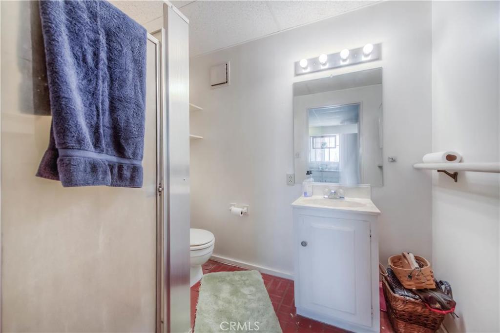 612 South Orange Street Orange, CA 92866 - Photo 43 of 44 a bathroom with a sink a toilet and mirror