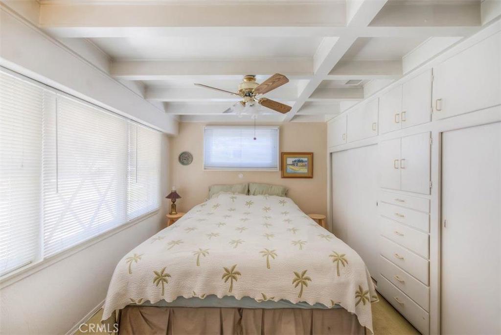 612 South Orange Street Orange, CA 92866 - Photo 6 of 44 a bed sitting in a bedroom and chandelier