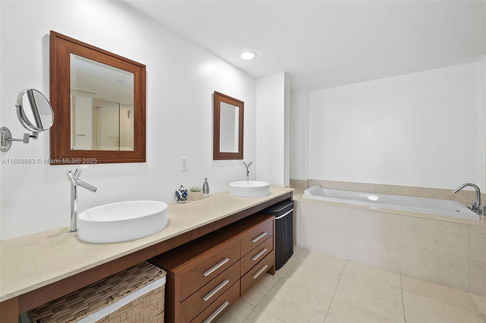 495 Brickell Avenue, Unit 2905 Miami, FL 33131 - Photo 16 of 53 a bathroom with a double vanity sink and mirror