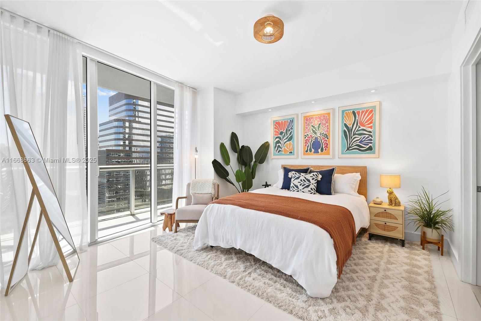 495 Brickell Avenue, Unit 2905 Miami, FL 33131 - Photo 22 of 53 a bedroom with a bed and a large window
