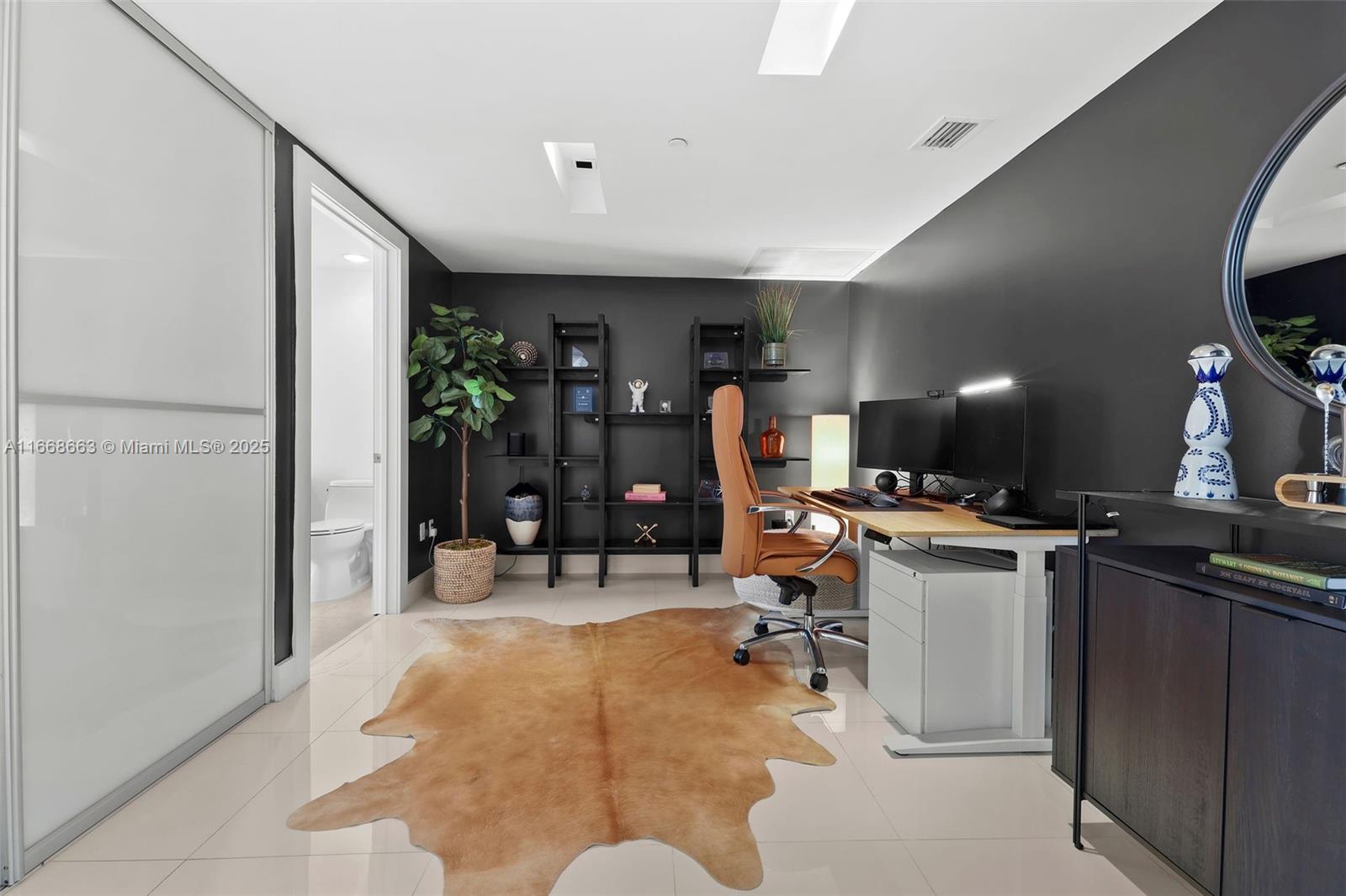 495 Brickell Avenue, Unit 2905 Miami, FL 33131 - Photo 29 of 53 a view of a room with workspace and windows