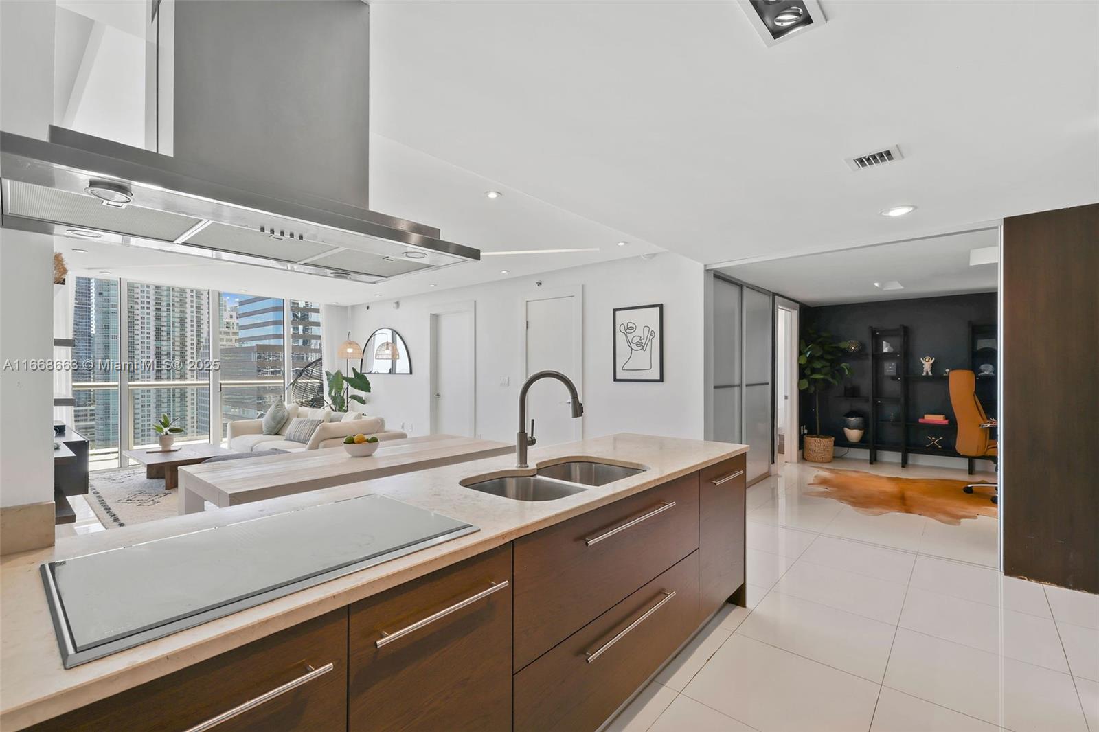 495 Brickell Avenue, Unit 2905 Miami, FL 33131 - Photo 3 of 53 a kitchen with granite countertop a sink and a counter top space
