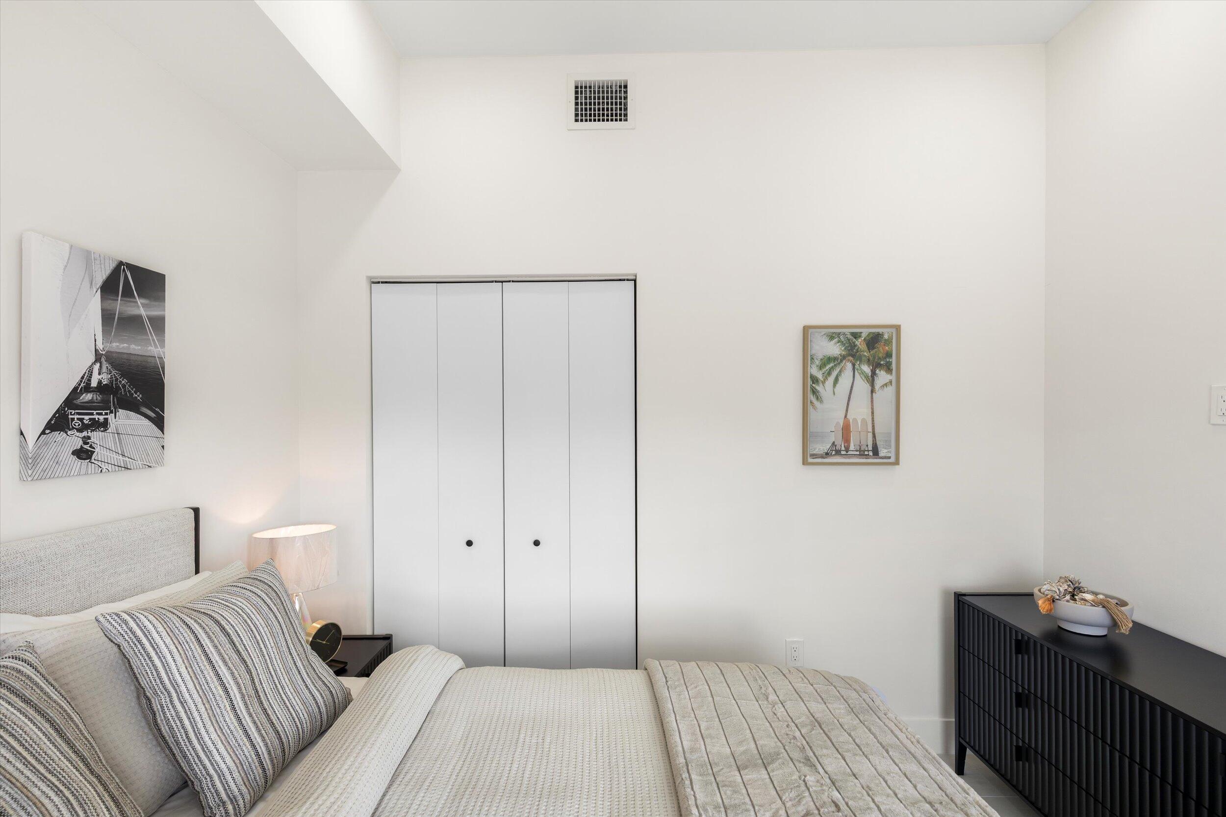 27433 Antigua Road Summerland Key, FL 33042 - Photo 10 of 64 a bedroom with a bed and painting on the wall