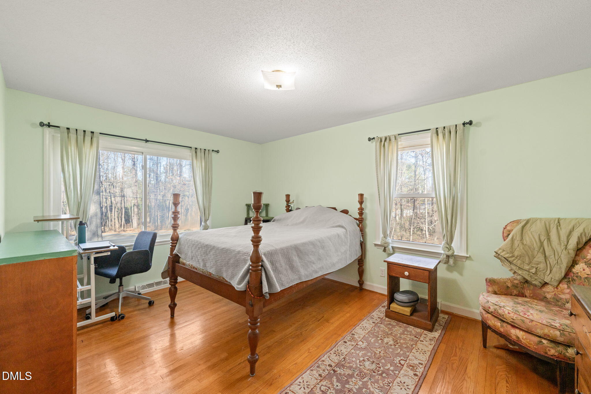 2802 Glover Road Durham, NC 27703 - Photo 16 of 44 a bedroom with a bed and a couch
