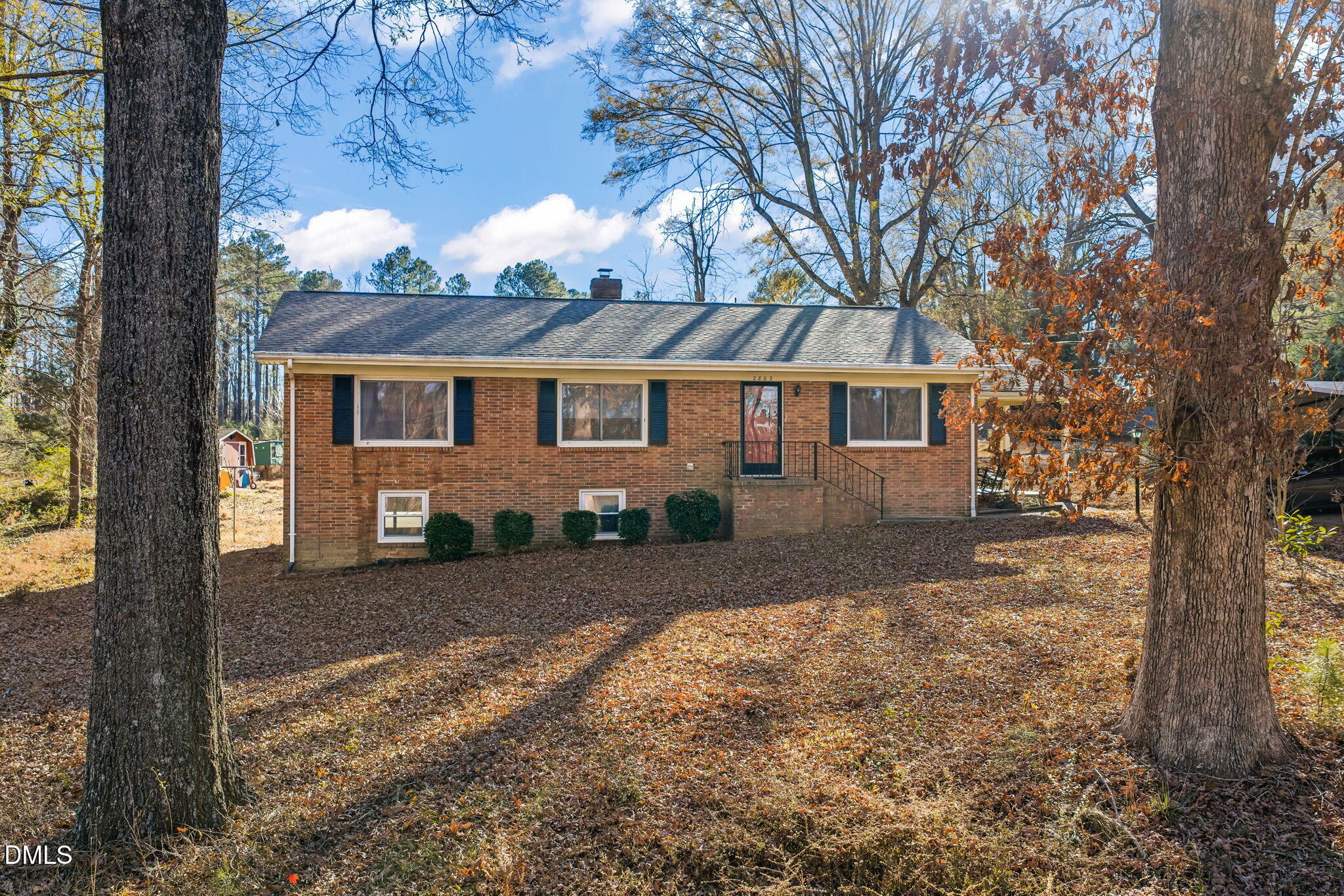 2802 Glover Road Durham, NC 27703 - Photo 2 of 44 a view of a yard in front of a house with large tree