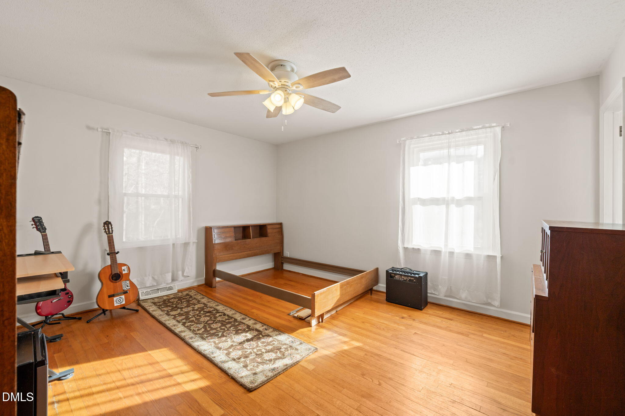 2802 Glover Road Durham, NC 27703 - Photo 21 of 44 a bedroom with a bed and a window
