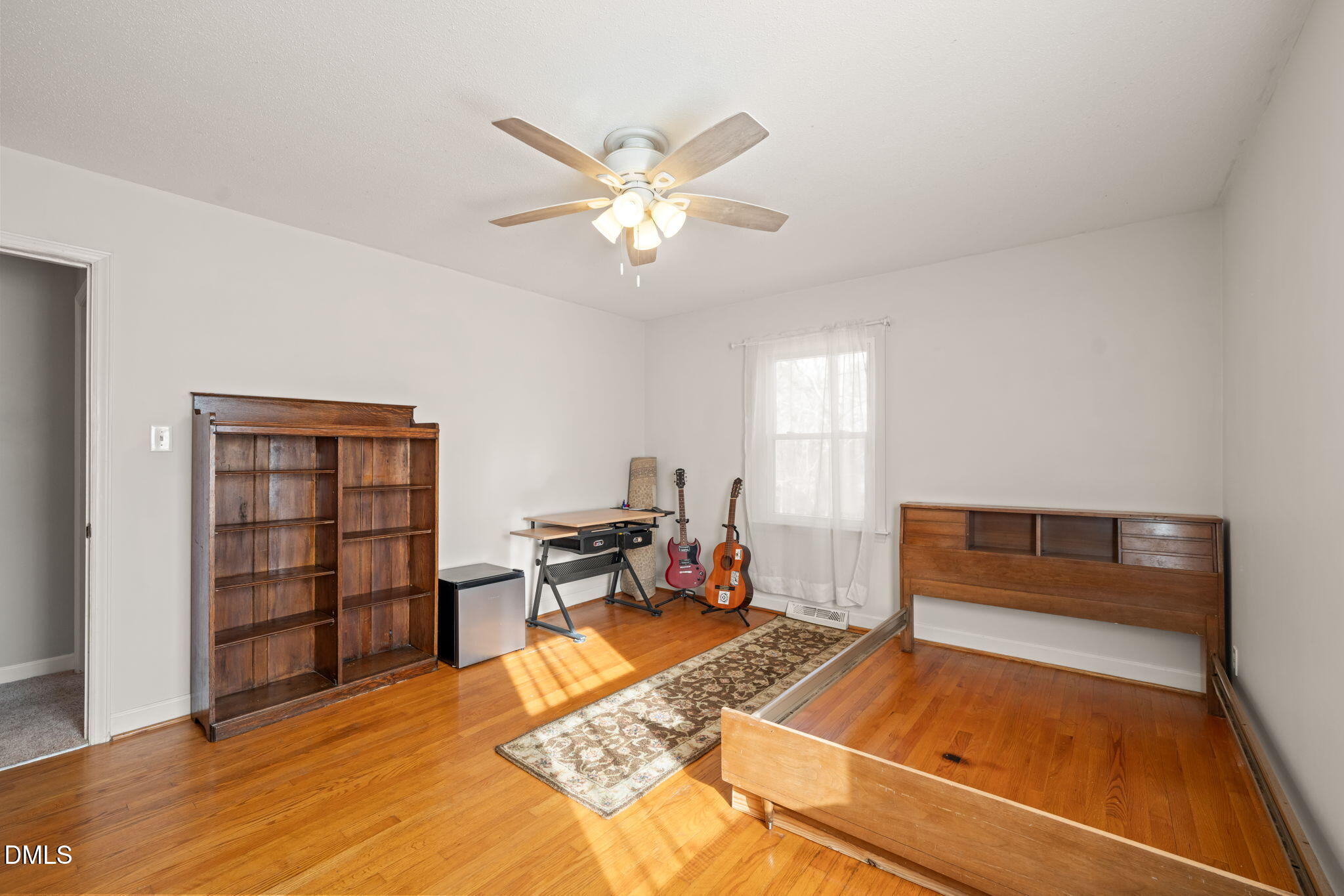 2802 Glover Road Durham, NC 27703 - Photo 22 of 44 a living room with furniture and a rug