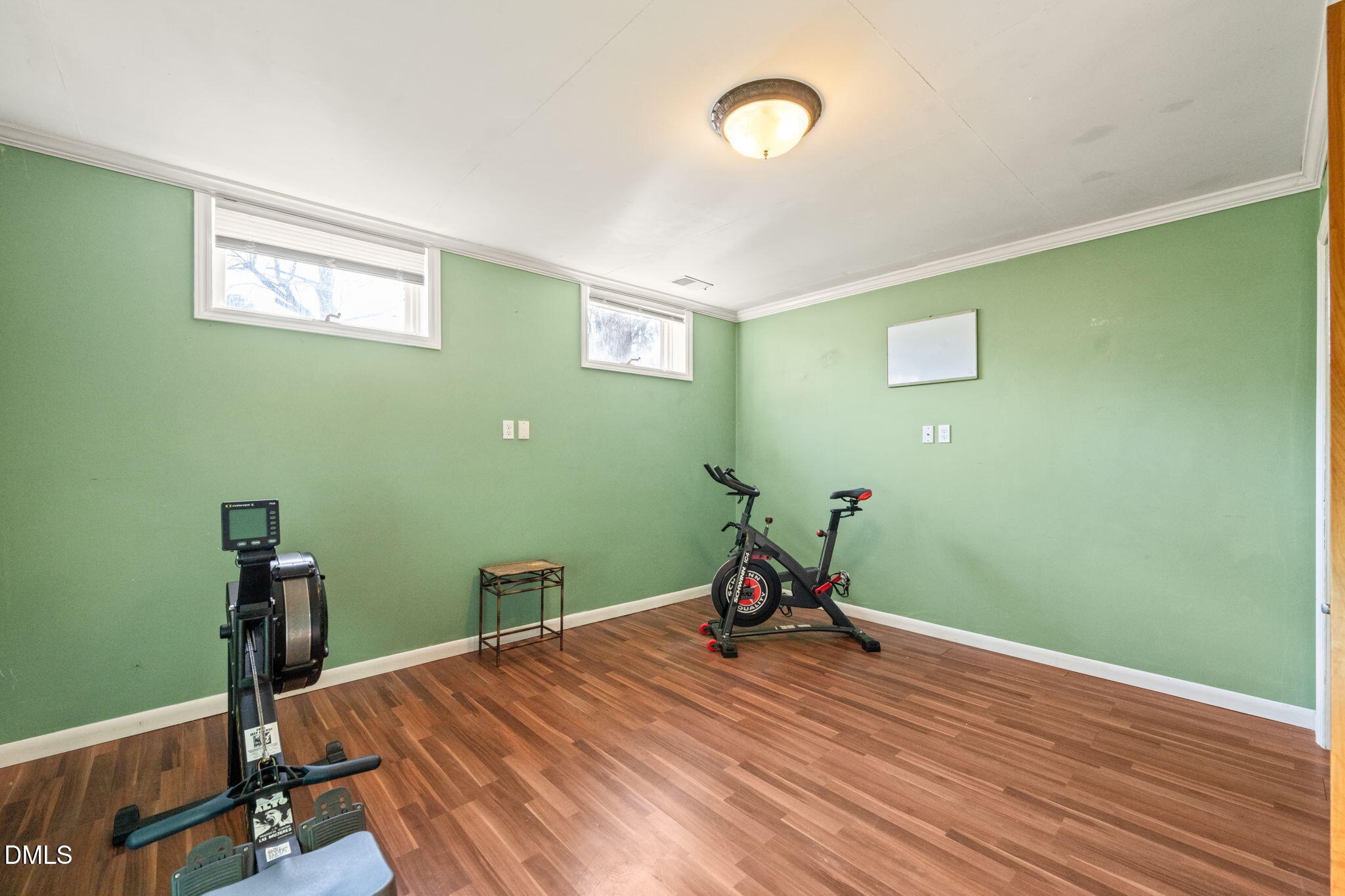 2802 Glover Road Durham, NC 27703 - Photo 27 of 44 a room with a wooden floor and a table