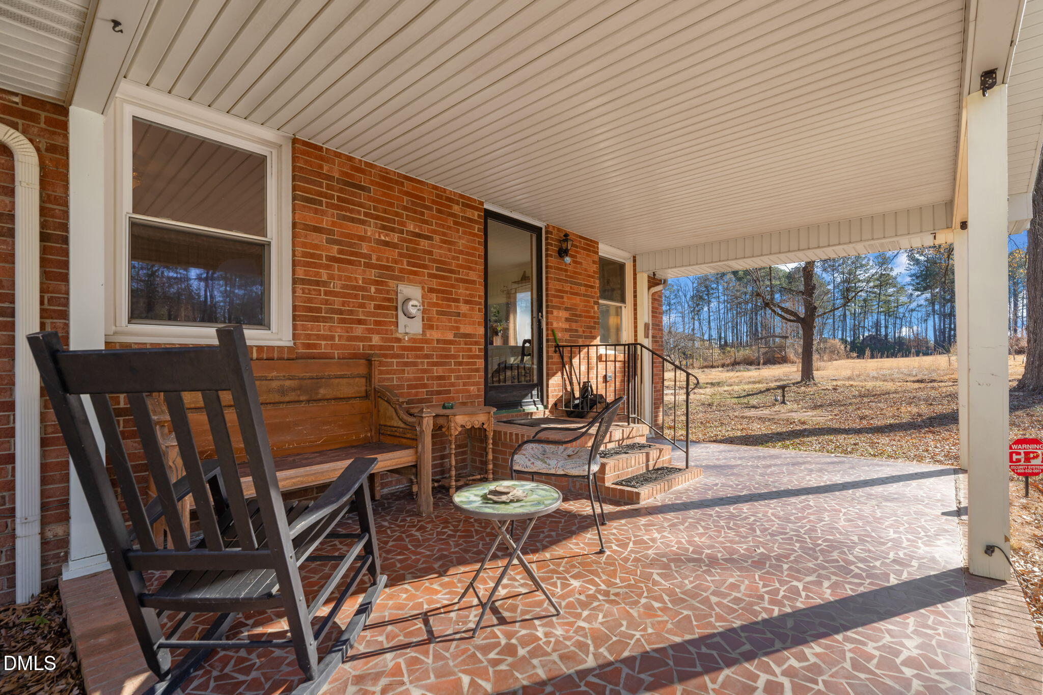 2802 Glover Road Durham, NC 27703 - Photo 32 of 44 a view of a patio with table and chairs and potted plants
