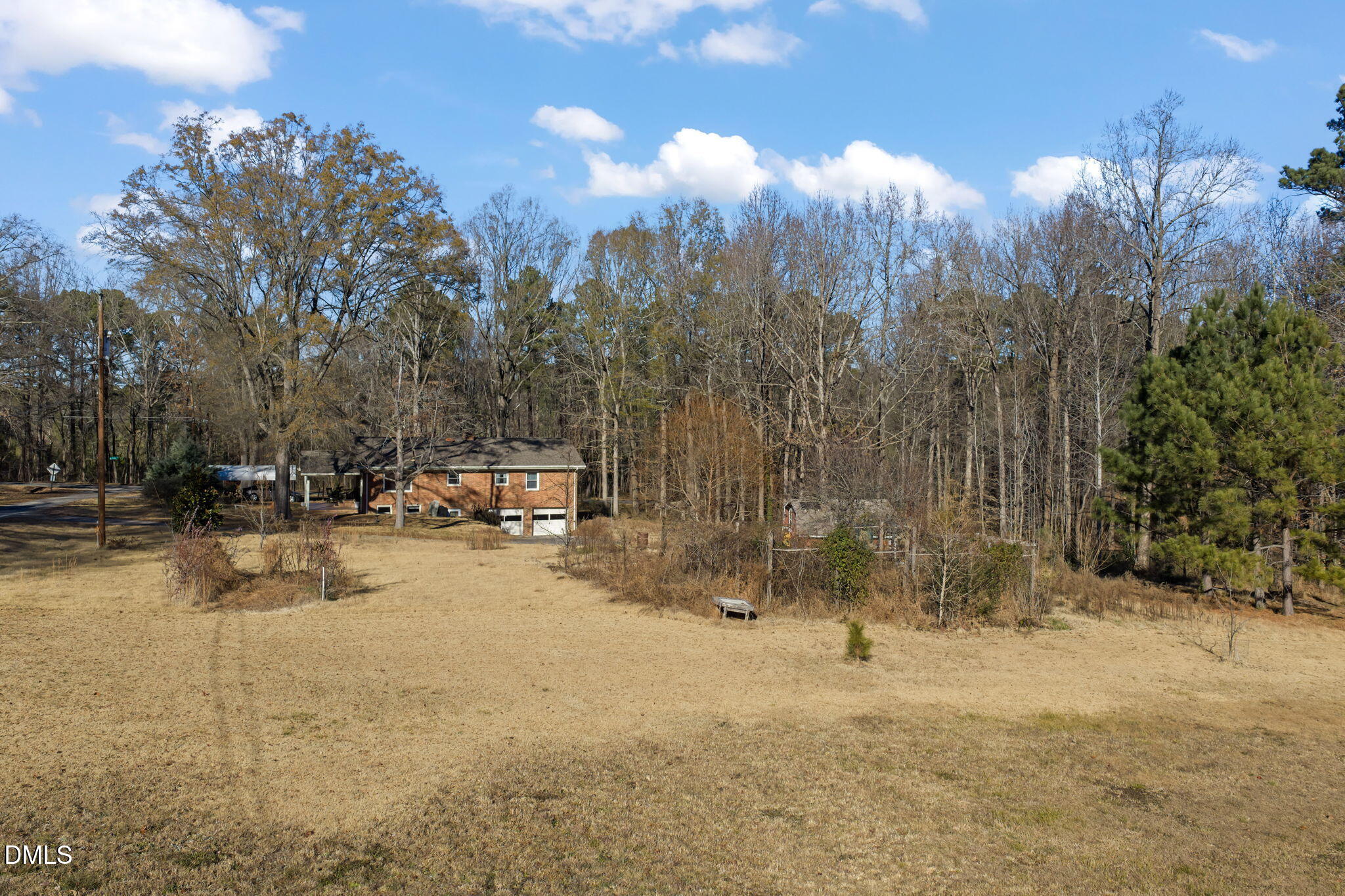 2802 Glover Road Durham, NC 27703 - Photo 38 of 44 a view of a yard with a tree