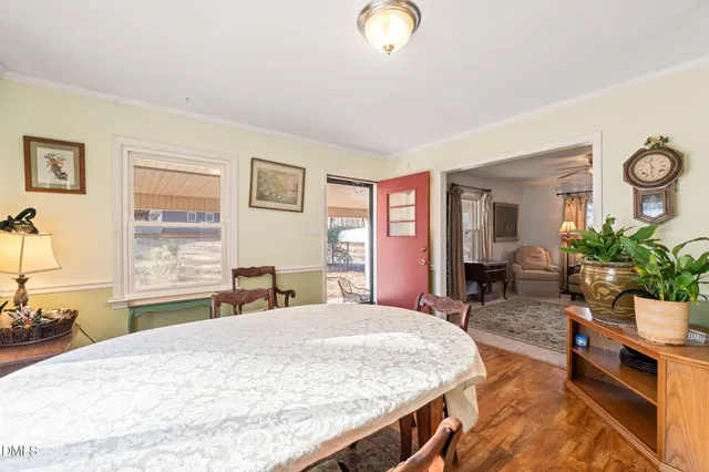 a bed room with a bed and a chair