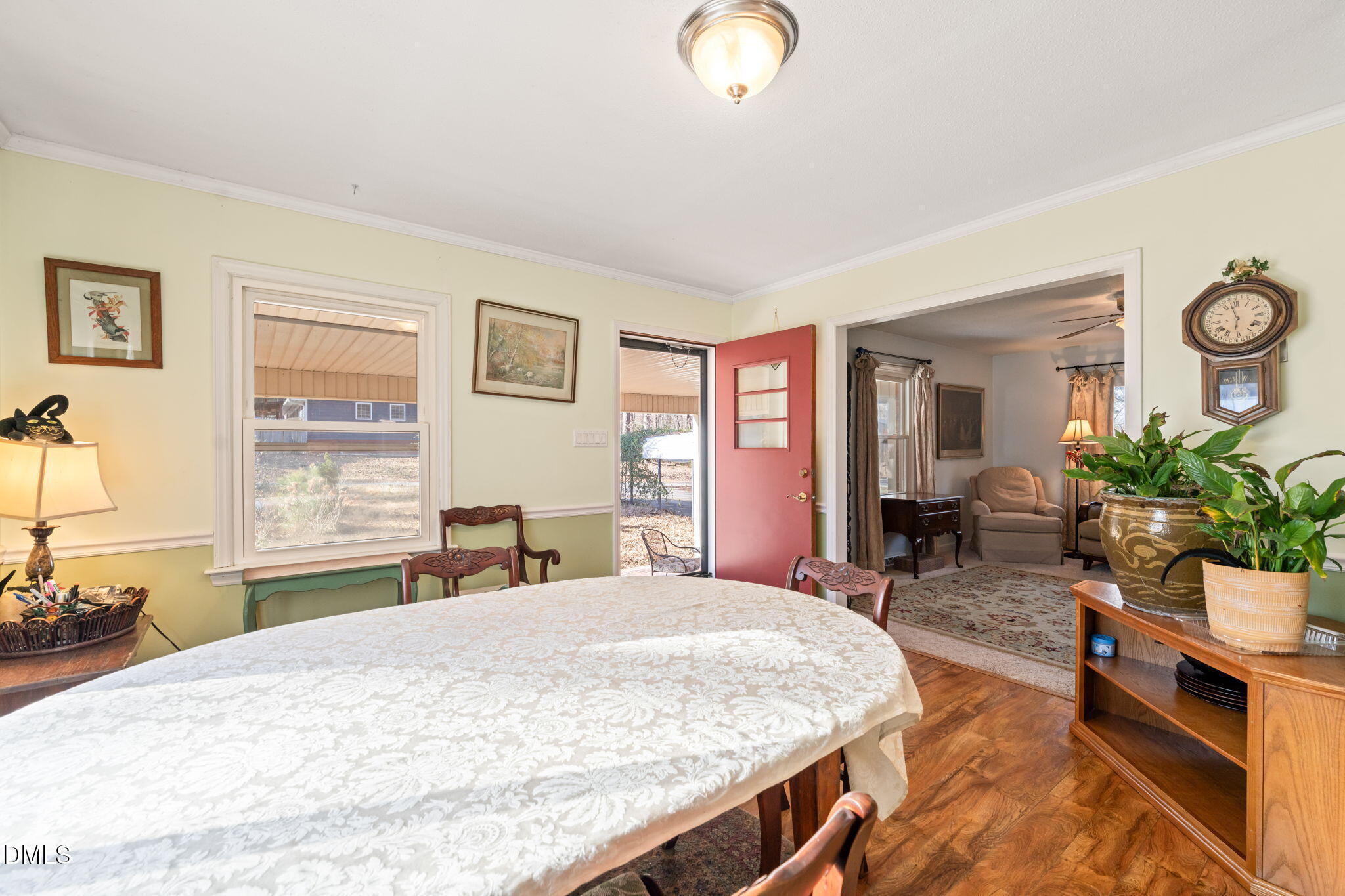 2802 Glover Road Durham, NC 27703 - Photo 9 of 44 a bed room with a bed and a chair