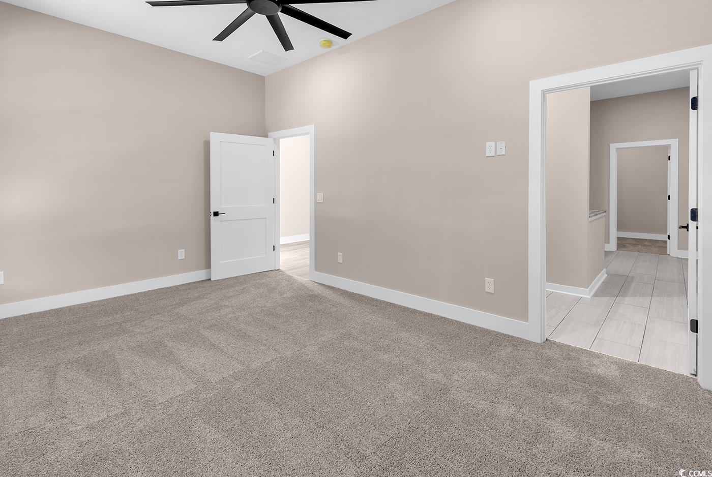 535 Mary Lou Avenue Murrells Inlet, SC 29576 - Photo 14 of 30 Master Baedroom, light colored carpet and a ceiling fan