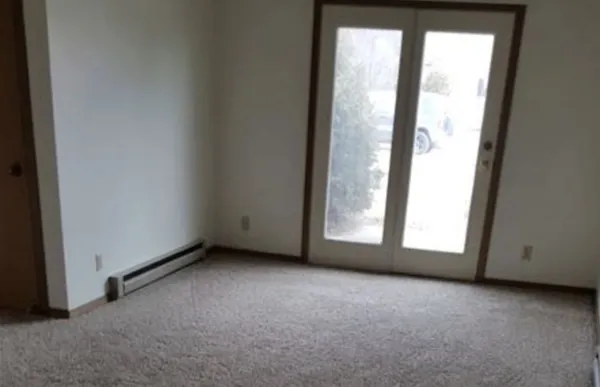 a view of a room that has a window in it