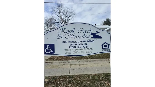 a sign on top of a wall