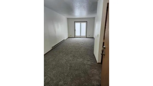 a view of a room with a white walls