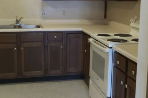 a kitchen with a sink and cabinets