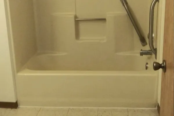 a close up of a bathtub in a bathroom