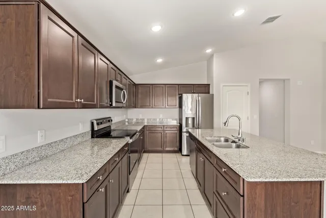 an empty room with windows and entrance