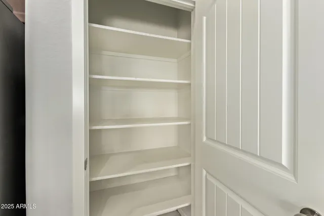 a backyard of a house with a bench