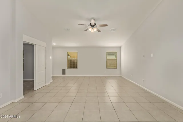 a view of an empty room with a fan